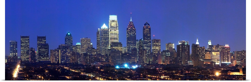 Panoramic nightscape photograph of the Philadelphia skyline.