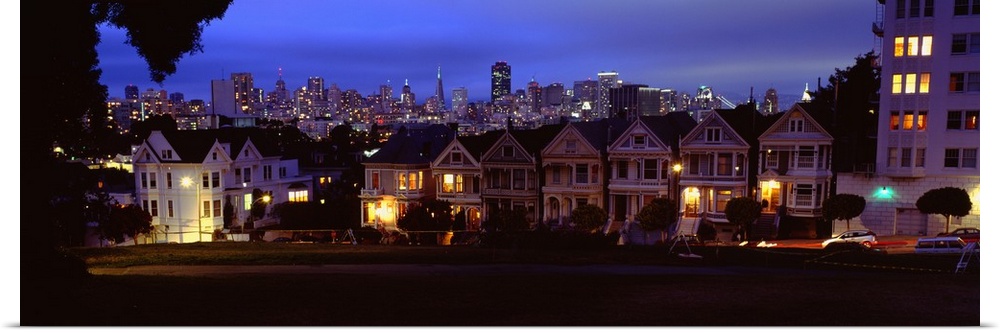 San Francisco's Painted Ladies of Alamo Square with building skyline in the background.