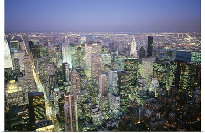 Buildings lit up in a city a night, Manhattan, New York City, New York
