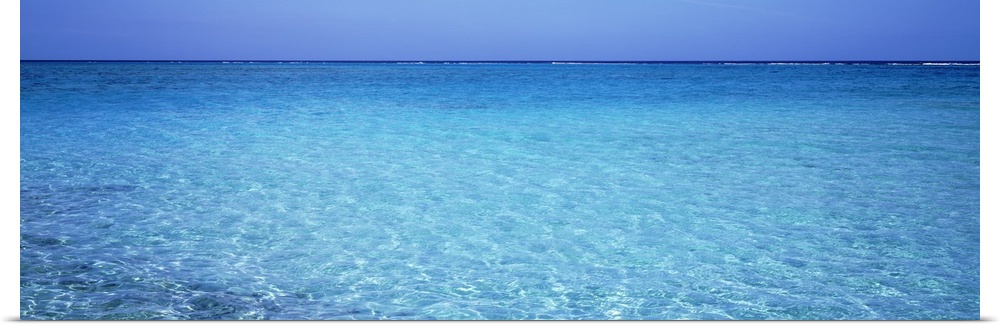 Long panoramic photo print of crystal clear ocean water in the Caribbean.