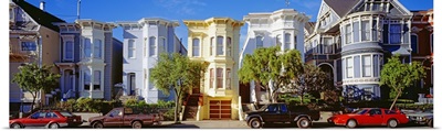 Cars parked in front of Victorian houses, San Francisco, California