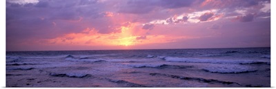 Cayman Islands, Grand Cayman, 7 Mile Beach, Caribbean Sea, Sunset over waves