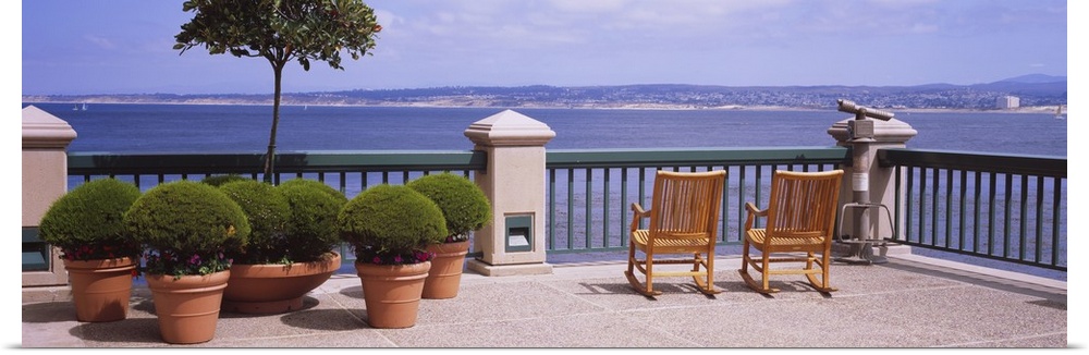 Chairs and potted plants on a deck, Monterey Bay, California