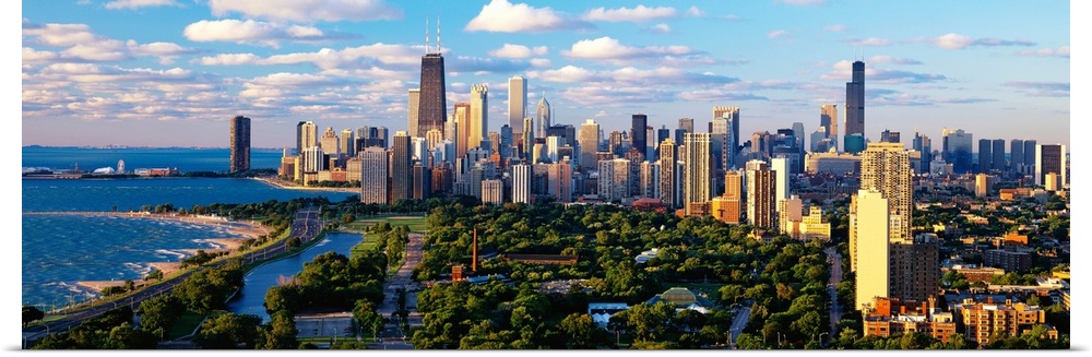 Panoramic photograph taken of the busy skyline of Chicago, Illinois on a sunny day.  The skyscrapers in the background are...