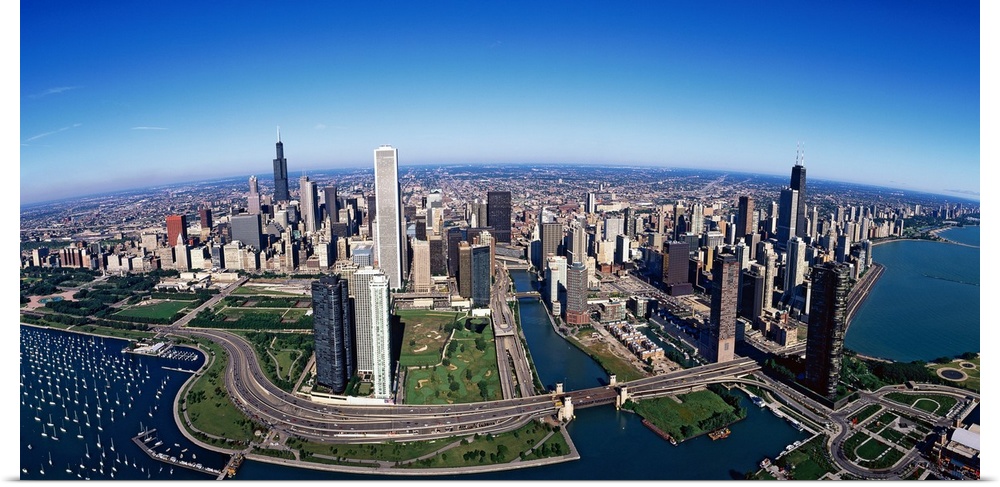 Giant panoramic photo of downtown Chicago, Illinois (IL). Skyscrapers and boats in Lake Michigan are visible.