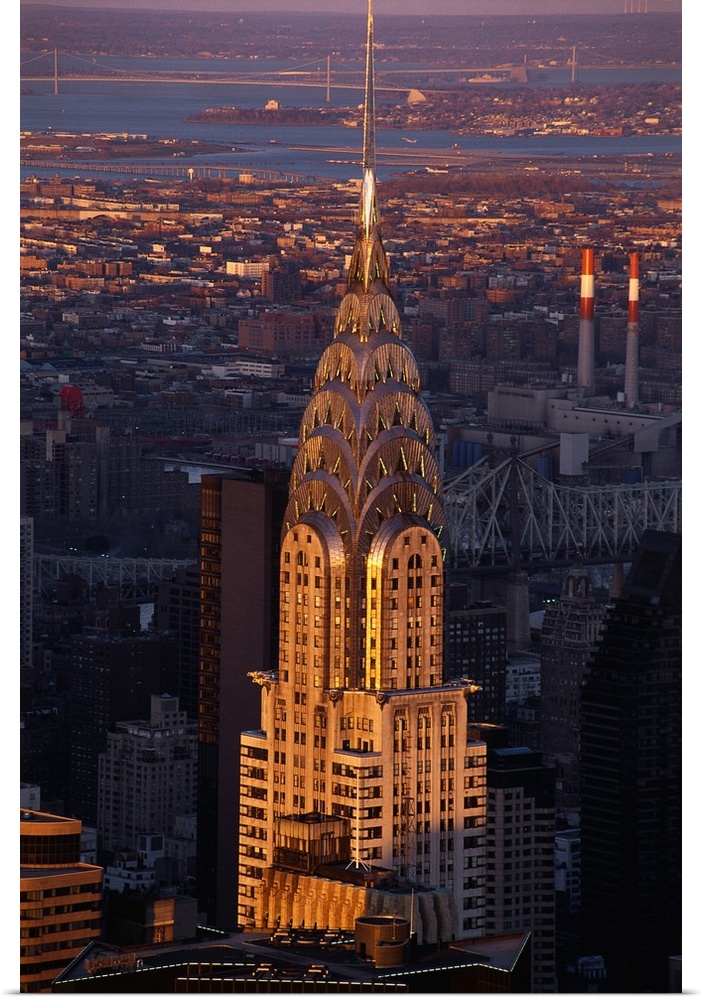 Vertical, large aerial photograph of the Chrysler Building in the sunlight, in New York City.
