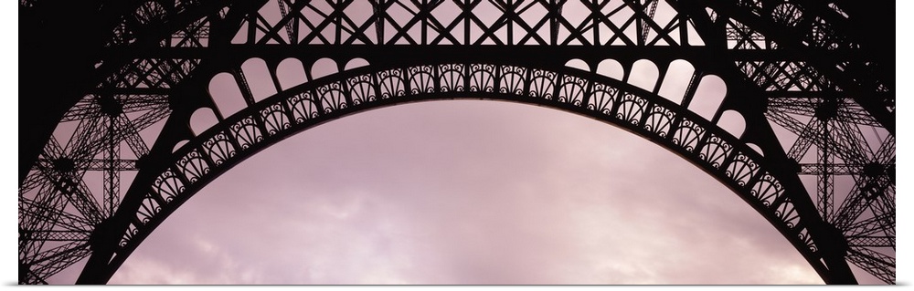 One of the arches at the bottom of the Eiffel Tower is pictured in panoramic view.