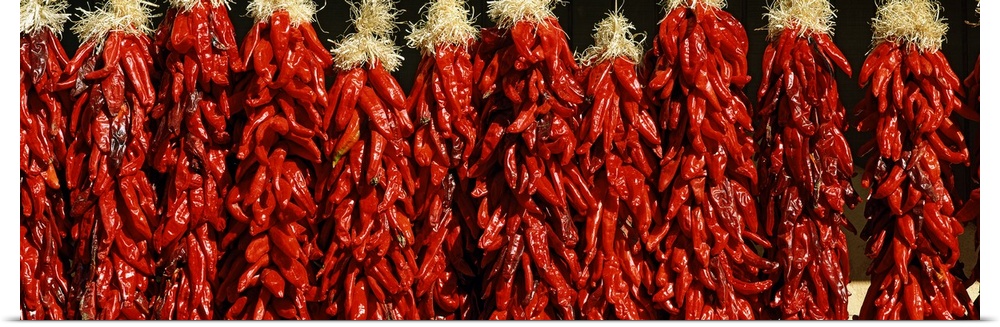 Several bunches of red peppers hung out to dry in Taos County, New Mexico.