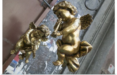 Close-up of two golden cherubs, Naples, Campania, Italy