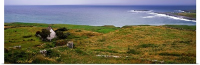 Coastal landscape with white stone house, Galway Bay, The Burren region, Ireland