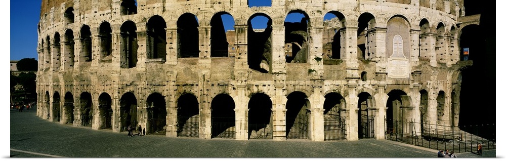 Panorama of the Roman Colosseum with detail of the arches.