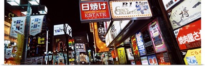Commercial signboards lit up at night in a market, Shinjuku Ward, Tokyo Prefecture, Kanto Region, Japan