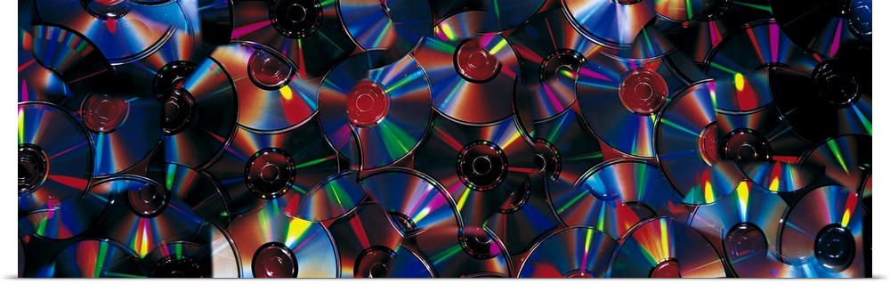 Panoramic piece of a collage that consists of CDs.