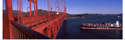 Container ship passing under a suspension bridge Golden Gate Bridge San Francisco Bay San Francisco California