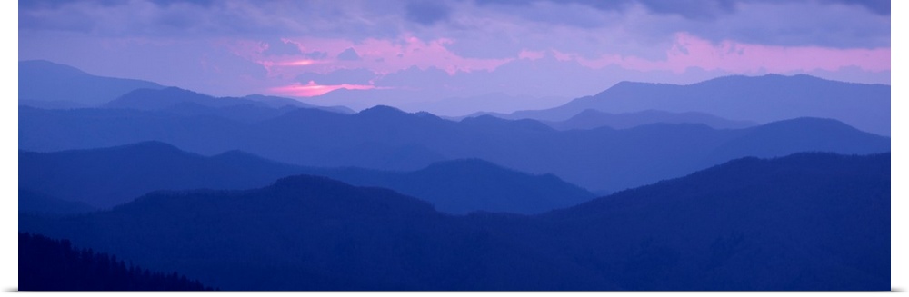 A panoramic photograph of the Appalachian Mountains under a pastel colored sky at sunrise.