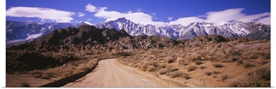 Dirt road passing through an arid landscape, Lone Pine, Californian Sierra Nevada, California