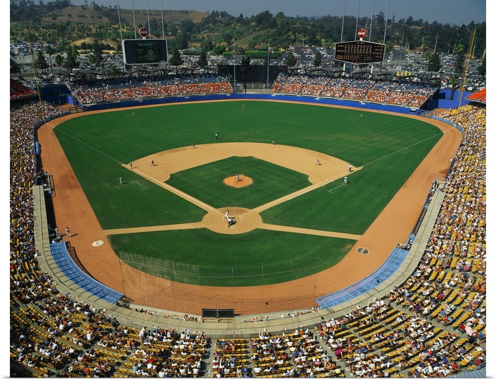 Landscape, aerial photograph of the stands packed at Dodger Stadium during a baseball game.