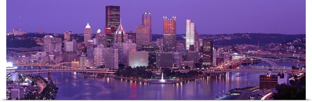 Big, wide angle photograph of Pittsburgh taken at night.