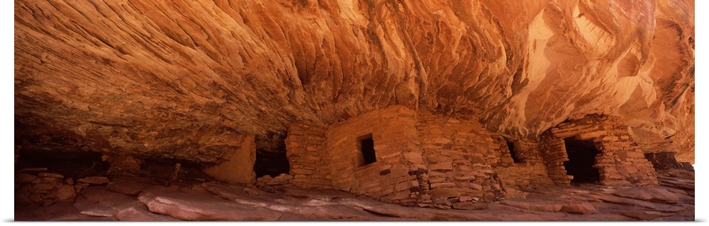 Panoramic wall art of ancient houses in the side of a cliff in Utah.