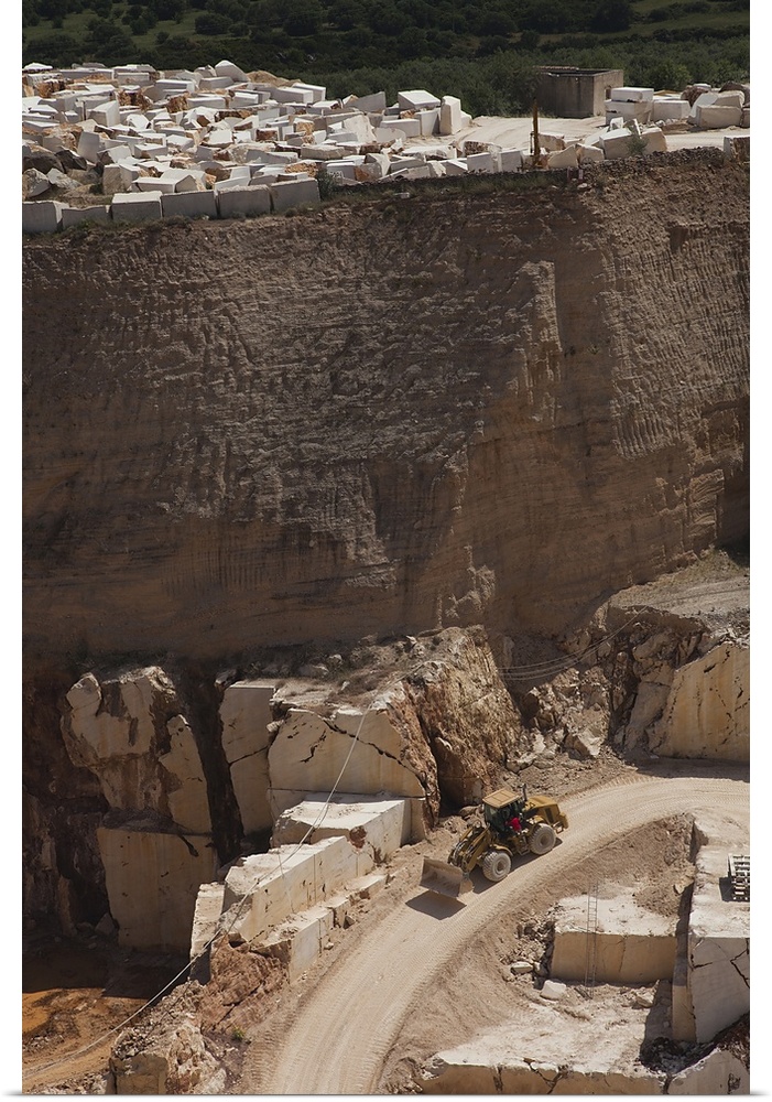 Earth mover at a marble quarry, Orosei, Golfo di Orosei, Sardinia, Italy