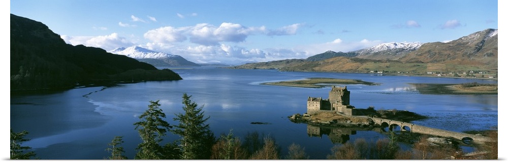 Aerial photograph of the Eilean Donan castle on an island where the three great sea lochs meet in Scotland.