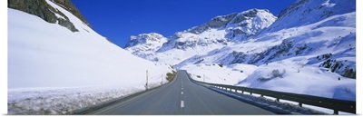 Empty road passing through a polar landscape, Route 3, Graubunden, Switzerland