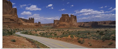 Empty road running through a national park, Arches National Park, Utah