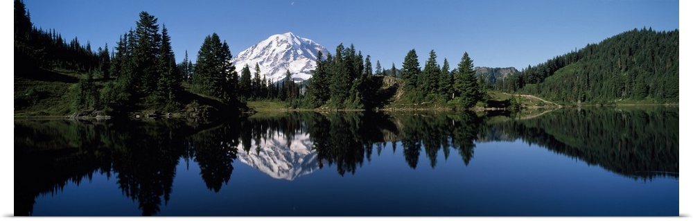 Panoramic photograph of Mount Rainier and surrounding green forest, reflecting in the still waters of Eunice Lake, in Moun...