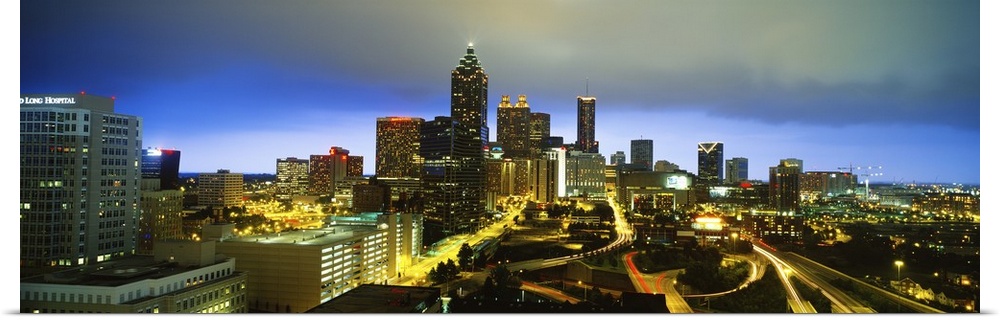 Large horizontal photo on canvas of downtown Atlanta at night lit up.