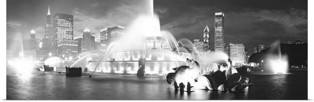 Horizontal canvas of a big water fountain in Illinois with downtown building in the background.