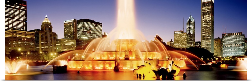 Panoramic photograph of the Buckingham Fountain in Chicago, Illinois (IL) in the evening.