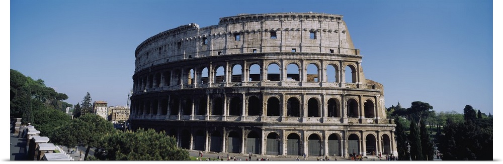 Wide angle photograph taken of the famous coliseum in Rome.