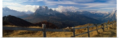 Fence with a mountain range in the background, Mt Rite, Dolomites, Cadore, Province of Belluno, Veneto, Italy