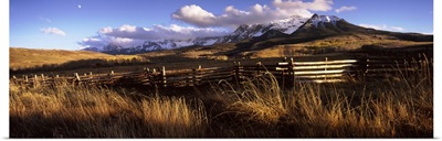 Fence with mountains in the background, Colorado,