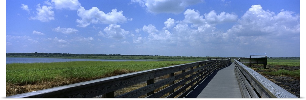 Florida, Sarasota, Myakka River State Park, Clouded sky over a wooden bridge