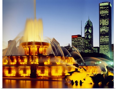 Fountain in a city lit up at dusk, Chicago, Illinois