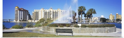 Fountain in a park with building in the background, Golden Gate Point, Bayfront Park, Sarasota Bay, Sarasota, Florida