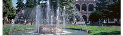 Fountain in Piazza Bra w/ Roman amphitheater Verona Italy
