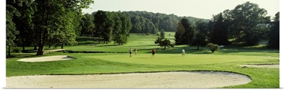 Four people playing on a golf course, Baltimore County, Maryland