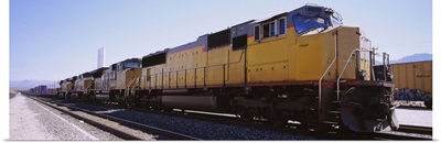 Freight train on railroad tracks, California