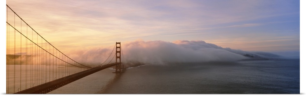 Panorama of rolling fog over the Golden Gate Bridge in San Francisco, California.