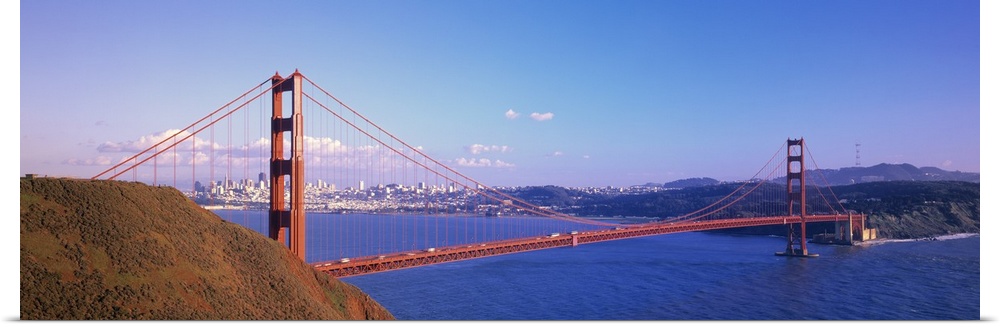 Panoramic photo on canvas of the Golden Gate Bridge spanning from left to right with the city in the background.