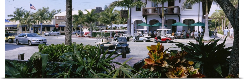 Golf carts and cars parked on a street, Boca Grande, Gasparilla Island, Florida