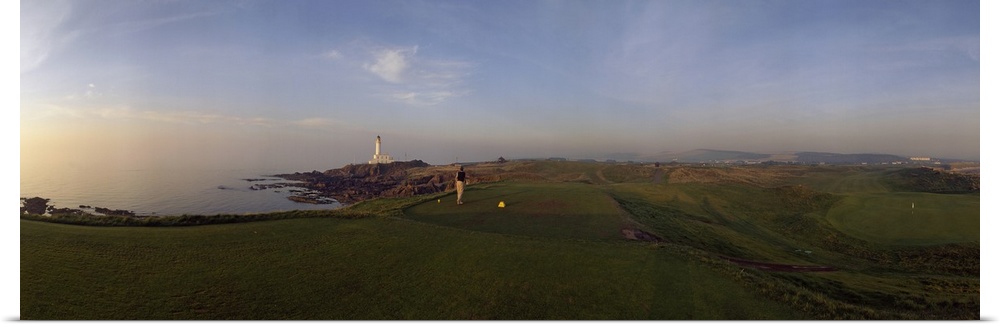 Golf course with a lighthouse in the background, Turnberry, South Ayrshire, Scotland