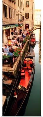 Gondolas moored outside of a cafe, Venice, Italy