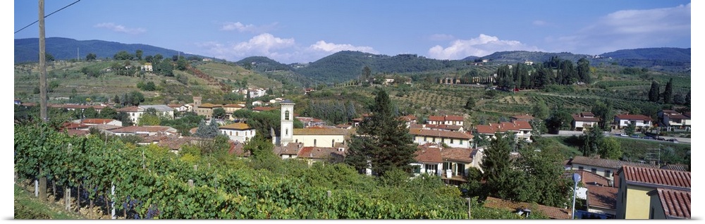 Panoramic canvas photo of an Italian town on rolling hills.