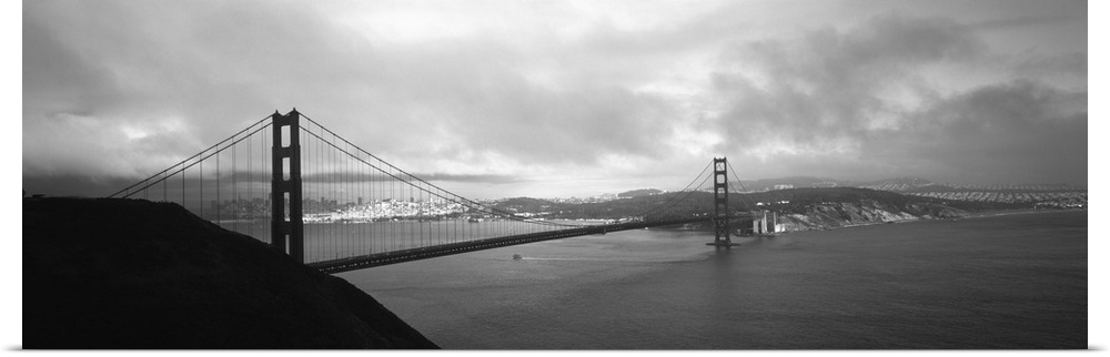 Giant black and white photograph of the Golden Gate Bridge in San Francisco, California (CA) on a cloudy day with some sun...