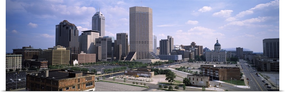 Photograph from above of the city skyline of Indianapolis, Indiana on a sunny day.