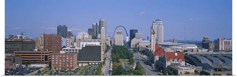 Panoramic, high angle photograph of the St. Louis skyline during the day, the Gateway Arch can be seen in the background, ...