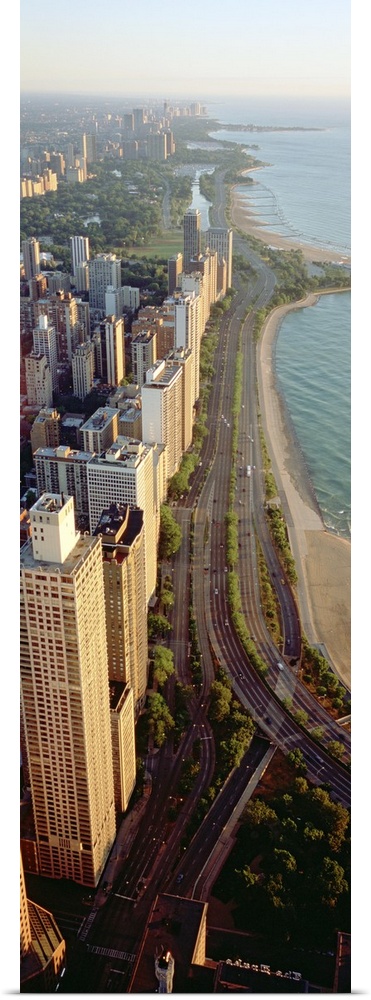 Arial vertical panoramic looking down at Lake Shore Drive in Chicago with the tall skyscrapers looking down at Lake Michigan.